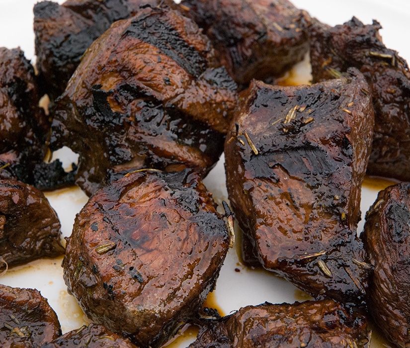 Close up of cooked lamb legs.