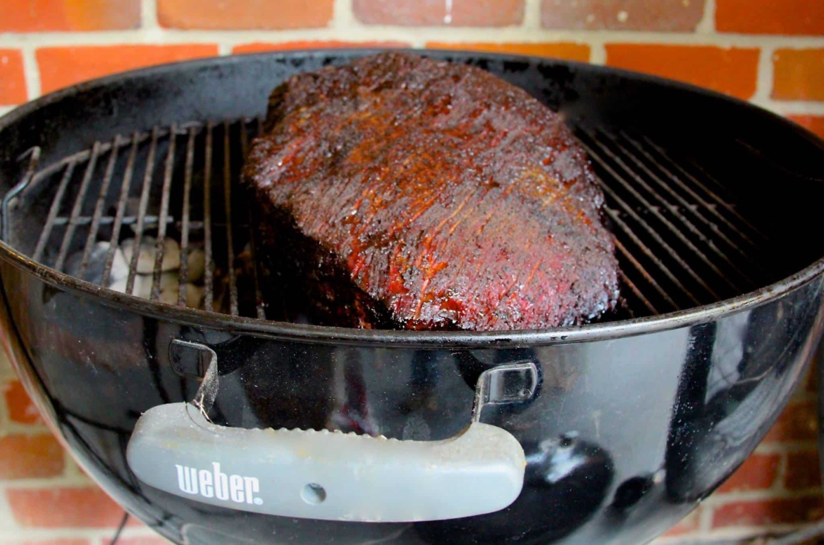 brisket on a grill.