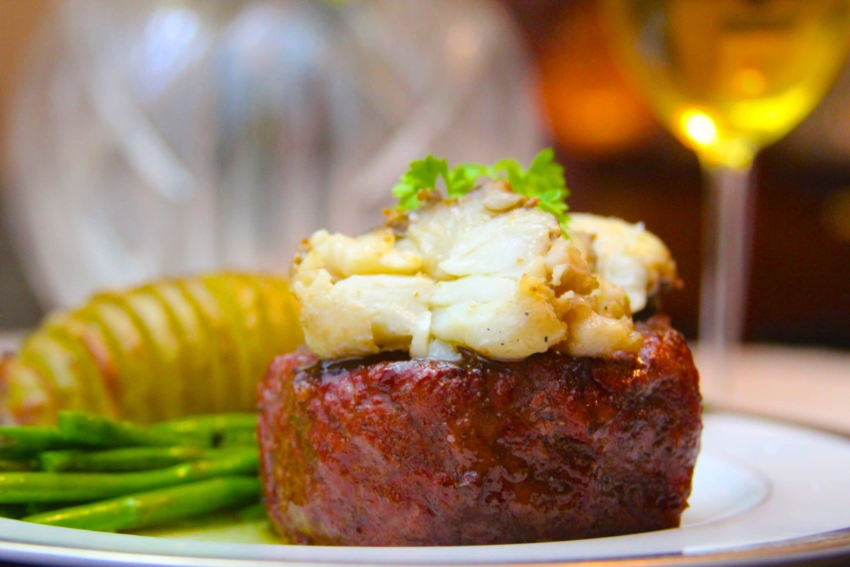 Plated smoked filet mignon with butter poached lobster tail