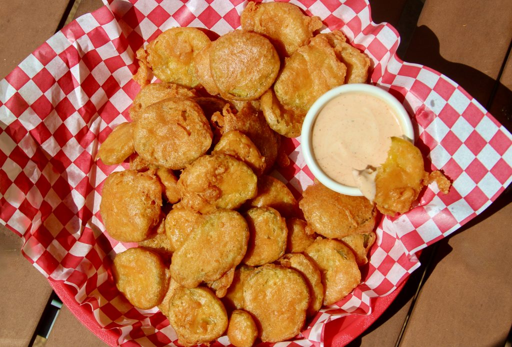 Deep fried pickles in a serving platter