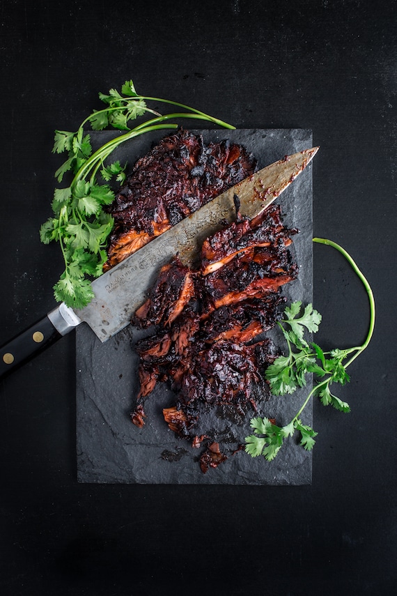 barbecue maitake steak on stone cutting board