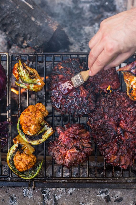 Basting a barbecued maitake mushroom