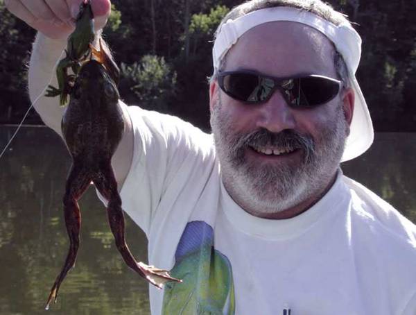 man with bullfrog