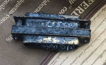burned computer cable found in a bag of lump charcoal