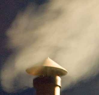 smoke coming out of a barbecue chimney
