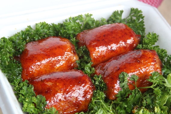 Competition BBQ chicken thighs in a turn-in box