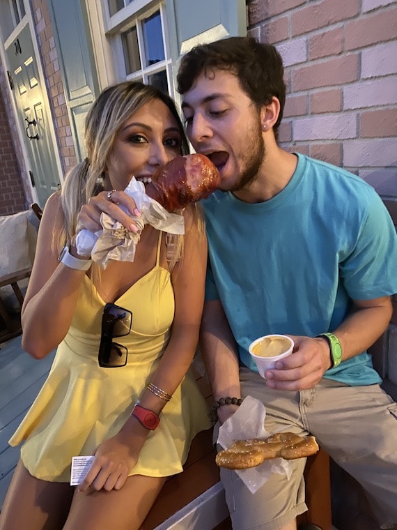Couple enjoying a smoked turkey leg