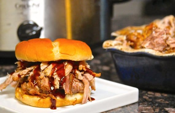pulled pork sandwich on white plate