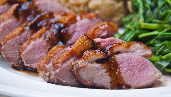 Sliced duck breast with cherry port sauce