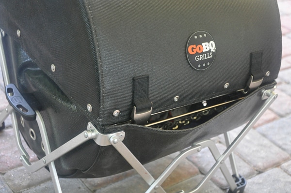 Black leathery basket with matching lid.