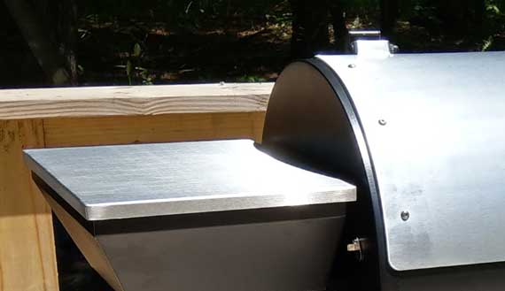 Shiny steel shelf attache to barrel.