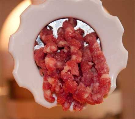 beef going through a grinder