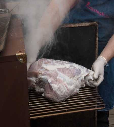 Fresh ham on a smoker