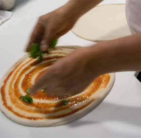 making pizza margherita in Rome