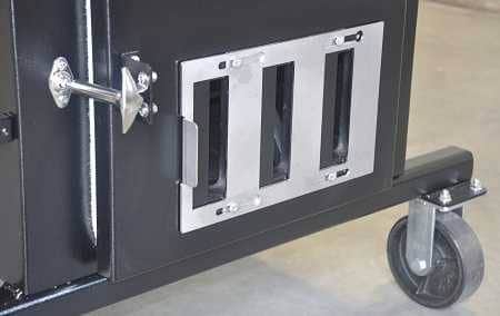 A black box with a door latched shut. A sliding shiny steel vent is on the door. 