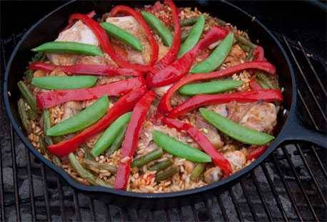 Paella cooking on the grill