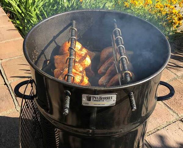 pit barrel cooker with meat hanging