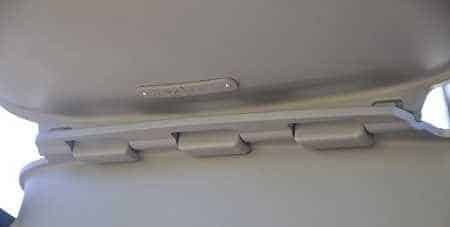 Grayish rectagular meatl object in two pieces joined by a hinge.