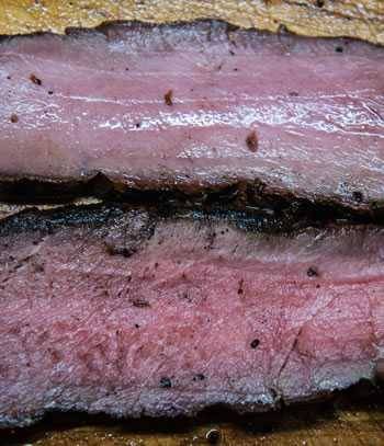 checking the color of meat for doneness