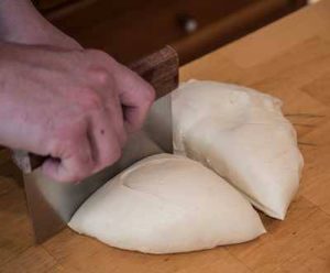 Cutting dough into portions