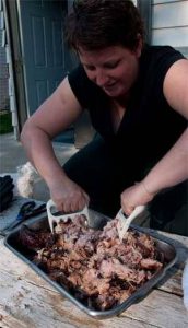 Shredding a smoked pork butt with bear paws
