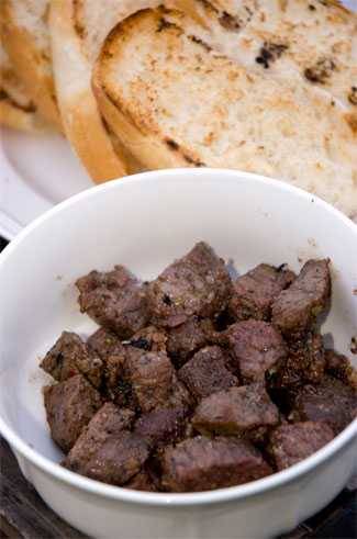 a white bowl filled with ras el hanout spiced meat