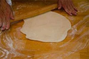 rolling pizza dough