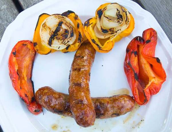 sausage and peppers on white plate