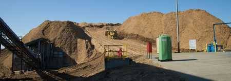 mountain of sawdust that will be formed into charcoal briquets