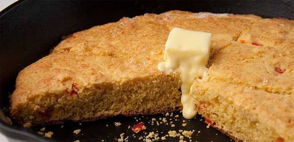 Skillet cornbread topped with butter