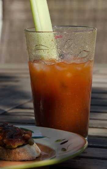 BBQ bloody Mary in glass with celery stalk