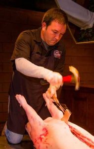Sam Jones splitting hog