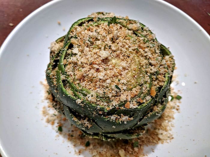 Cooked artichoke with breadcrumb topping