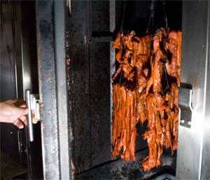 Strips of pork cooking in sun wah oven