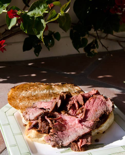 Sliced tri-tip on a tasted roll