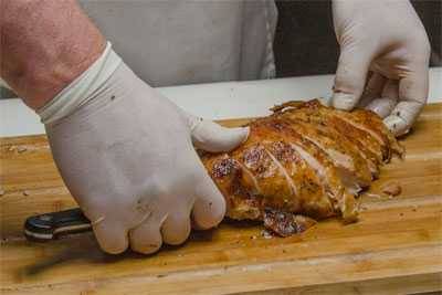 presenting the meat carved from the turkey