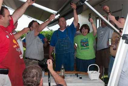 people cheering around a table