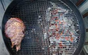Steak cooking on a 2-zone grill