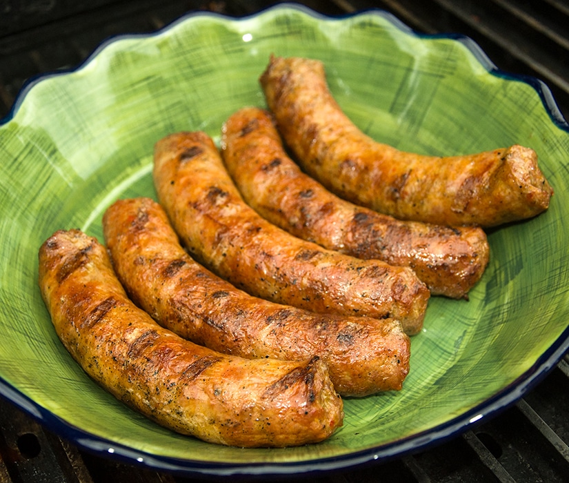 Plate of grilled chicken sausages.