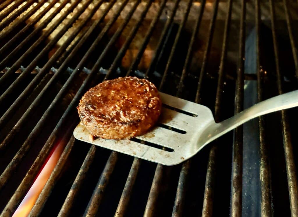 Flipping a burger.