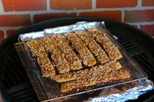 pecan topped bacon on a rack