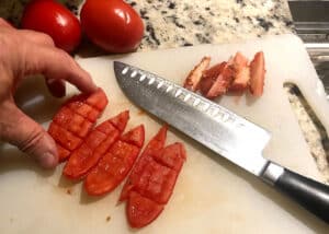 Scoring tomatoes.