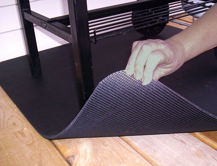 Grill mat under a BBQ grill.