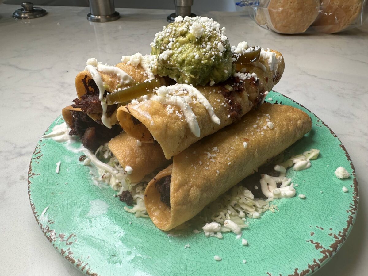plated carnitas taquitos.