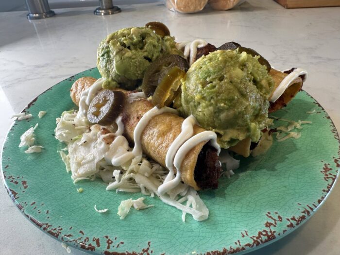 plated carnitas taquitos.