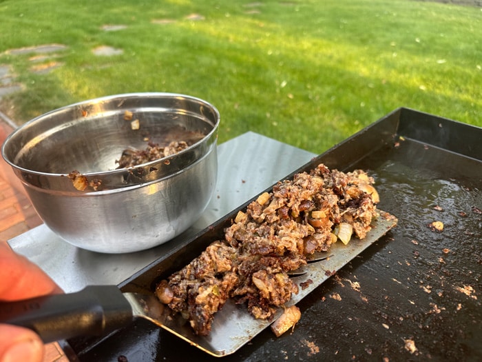Victory Griddle scooping cheese steak