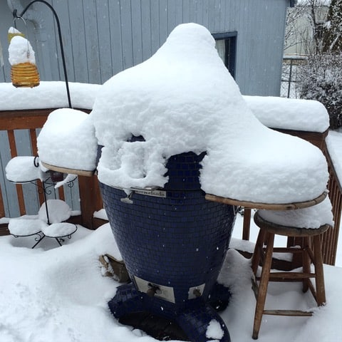 Grill covered in snow.