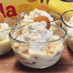 Banana pudding in glass bowls topped with whipped cream